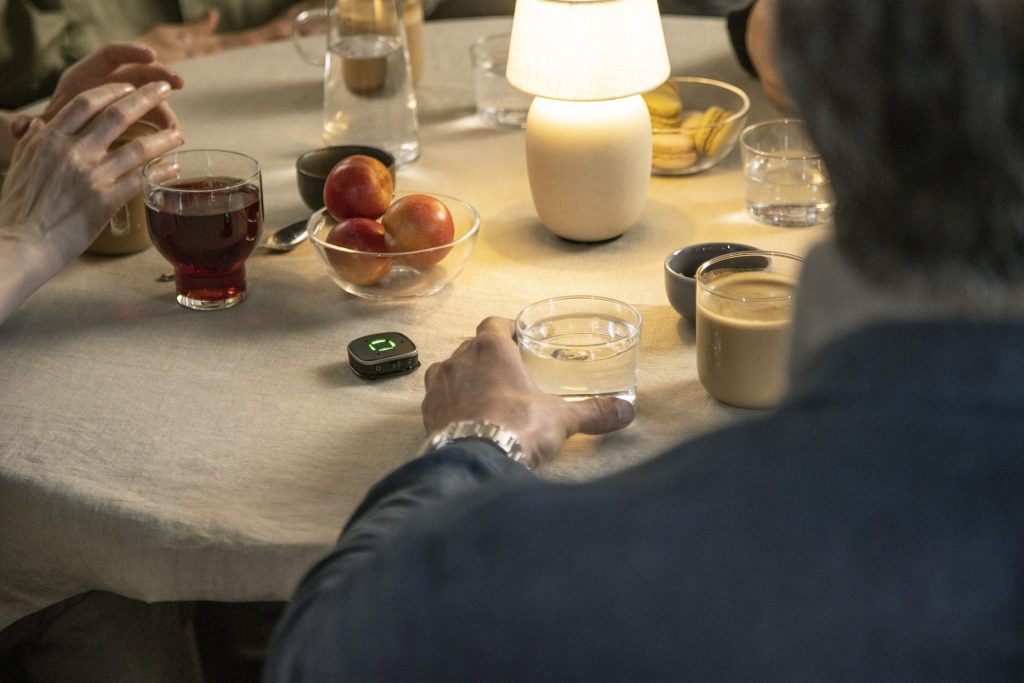 People gathered around a table with drinks